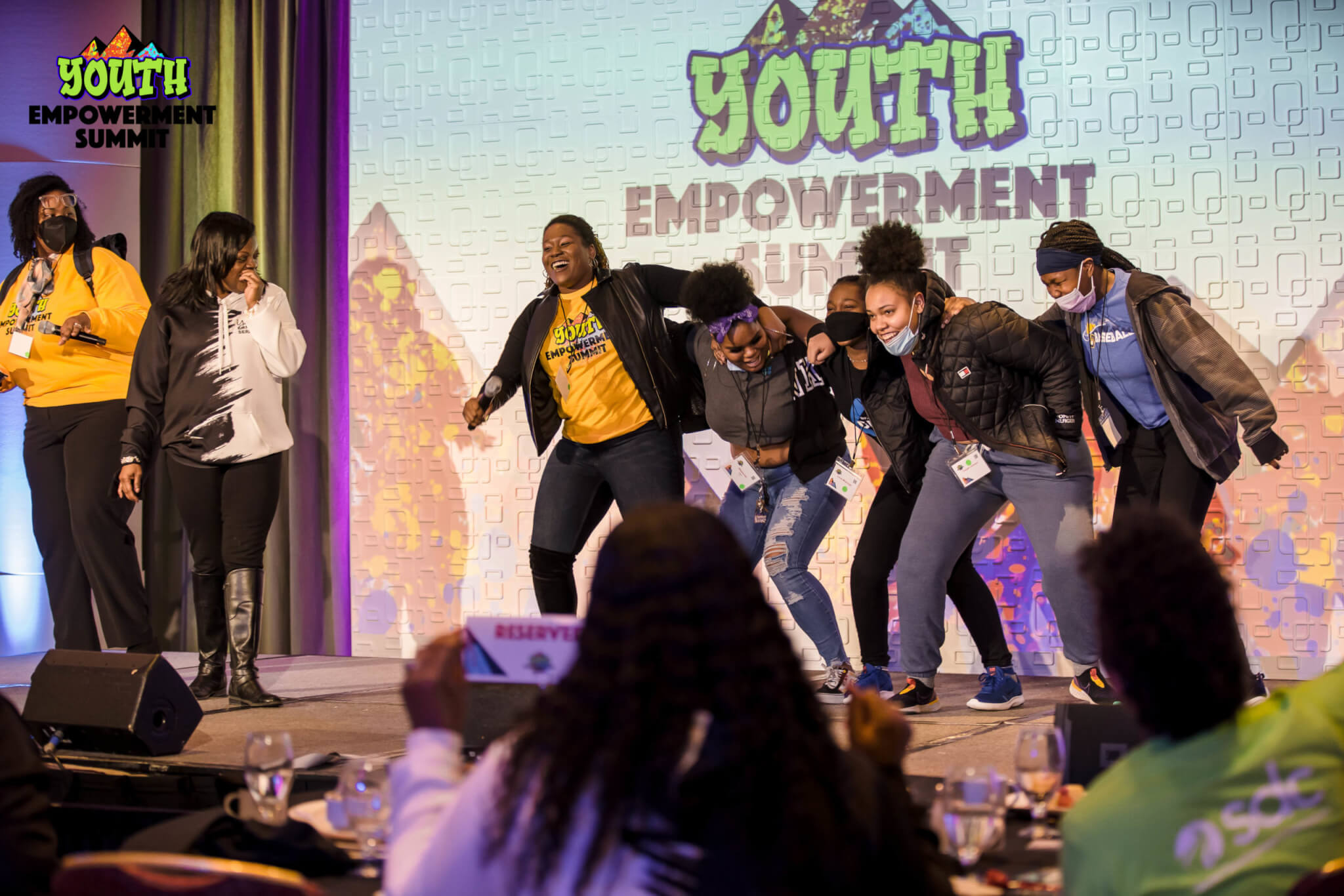 Students dancing with SDbC staff at the 2022 Youth Empowerment Summit