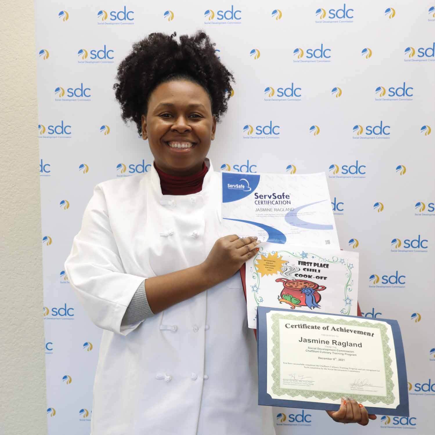 woman smiling with certifications