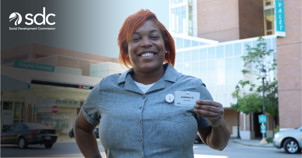 Woman posing with her work badge