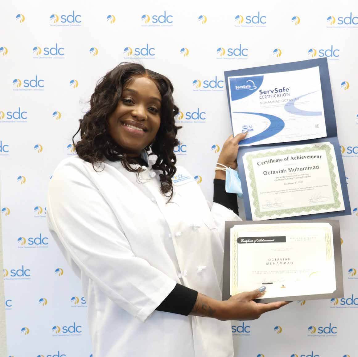 woman smiling with certifications